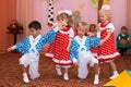Two couples children dancing in the children's holiday