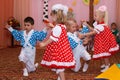 Two couples children dancing in the children's holiday