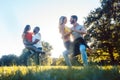 Two couples dancing kizomba during sunset in a park Royalty Free Stock Photo