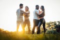 Two couples dancing kizomba during sunset in a park Royalty Free Stock Photo