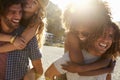 Two couples drinking on the beach, backlit, close up, Ibiza