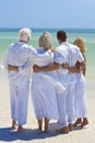 Two Couples Family Generations Embracing on Beach Royalty Free Stock Photo