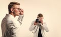 two cousin with retro photo camera. young confident brothers. confident model photographer