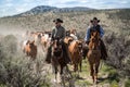 Two cowboys lead the horse herd on annual trail drive May 1, 2016 Craig, COrive roundup Royalty Free Stock Photo