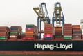 Two cranes load Hapag Lloyd ship in Laem Chabang container terminal, Thailand