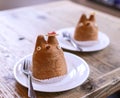 Two cream puffs shaped in the form of the Anime character Totoro