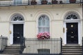 Two cream terraced town houses Royalty Free Stock Photo