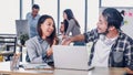 Two of creative designer handshake for success with laptop at modern office in morning at desk.casual workplace lifestyle