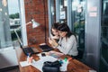 Two creative female designers choosing colors working with colour palette in the office Royalty Free Stock Photo