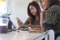 Two creative women colleagues working together. Royalty Free Stock Photo