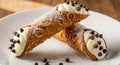 Delicious cannoli with creamy filling and chocolate chips served on a white plate for dessert or festive occasions Royalty Free Stock Photo