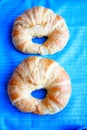 Two Croissant rolls with blue background Royalty Free Stock Photo