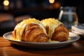 two croissants on a white plate