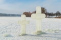 Two cross carved from ice on a winter lake near the ice hole at Epiphany Royalty Free Stock Photo