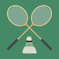 Two crossed badminton rackets and white shuttlecock with black line. Royalty Free Stock Photo