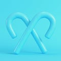 Two crossed candy cane bright blue background in pastel colors. Minimalism concept Royalty Free Stock Photo