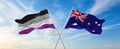 two crossed flags asexuality Pride and Australia waving in wind at cloudy sky. Concept of relationship, dialog, travelling between