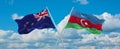 two crossed flags Azerbaijan and New Zealand waving in wind at cloudy sky. Concept of relationship, dialog, travelling between two