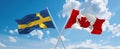 two crossed flags canada and Sweden waving in wind at cloudy sky. Concept of relationship, dialog, travelling between two