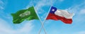 two crossed flags Chile and Saudi Arabia waving in wind at cloudy sky. Concept of relationship, dialog, travelling between two