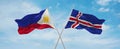 two crossed flags Iceland and Philippines waving in wind at cloudy sky. Concept of relationship, dialog, travelling between two