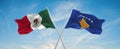 two crossed flags Kosovo and mexico waving in wind at cloudy sky. Concept of relationship, dialog, travelling between two