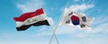 two crossed flags south korea and Iraq waving in wind at cloudy sky. Concept of relationship, dialog, travelling between two