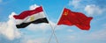 two crossed flags ussr and Egypt waving in wind at cloudy sky. Concept of relationship, dialog, travelling between two countries