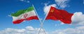 two crossed flags ussr and Iran waving in wind at cloudy sky. Concept of relationship, dialog, travelling between two countries