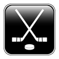 Two crossed hockey sticks and puck icon. Royalty Free Stock Photo