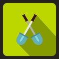 Two crossed shovels icon, flat style Royalty Free Stock Photo