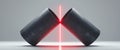 Two crossed textured cylinders with glowing red light on display Royalty Free Stock Photo