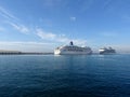 Two cruise ships docked at the port face to face on a day with blue sky Royalty Free Stock Photo