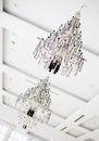 Two crystal chandeliers hanging on white ceiling Royalty Free Stock Photo