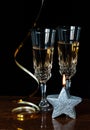 Two crystal glasses with champagne on black background Royalty Free Stock Photo