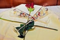 Two crystal glasses for champagne with a red rose on a tray. Royalty Free Stock Photo