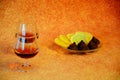 Two crystal glasses of cognac and a plate with slices of lemon and chocolates Royalty Free Stock Photo