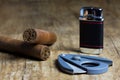 Two Cuban cigars with a lighter and a cutter Royalty Free Stock Photo