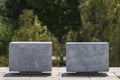 Two cube-shaped stone seats