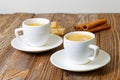 Two cup of hot esspresso, cinnamon and sugar cane Royalty Free Stock Photo