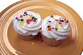 Two cupcakes on a yellow plate Royalty Free Stock Photo