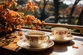 Two cups and autumn decor with flowers, sunny day. Generative AI