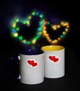 Two cups on a black background with bokeh Royalty Free Stock Photo