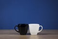 Two cups black and white Royalty Free Stock Photo