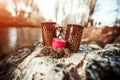 Two cups and candle standing on the stone