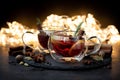 Two cups of Christmas mulled wine or gluhwein with spices and lemon slices on dark wooden background with defocused lights. Royalty Free Stock Photo