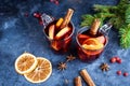Two cups of christmas mulled wine or gluhwein with spices and orange slices on rustic table top view. Traditional drink on winter Royalty Free Stock Photo