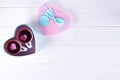 Two cups of coffee in a box in the form of a heart on a white background. Valentine`s day concept, flat lay with copy Royalty Free Stock Photo