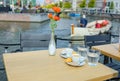 Two cups of coffee on cafÃÂ© table on beautiful Dutch terrace by canal water, Leiden, Netherlands