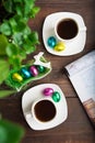 Two cups of coffee with chocolate eggs in Easter morning Royalty Free Stock Photo